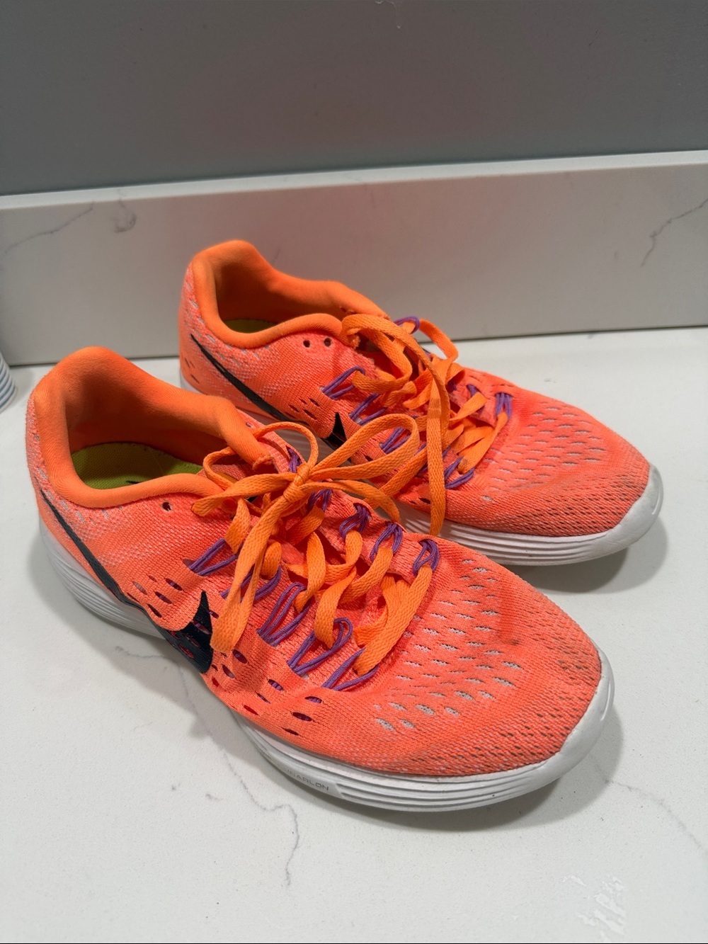 Nike Neon Orange Running Sneakers with Purple Eyelets